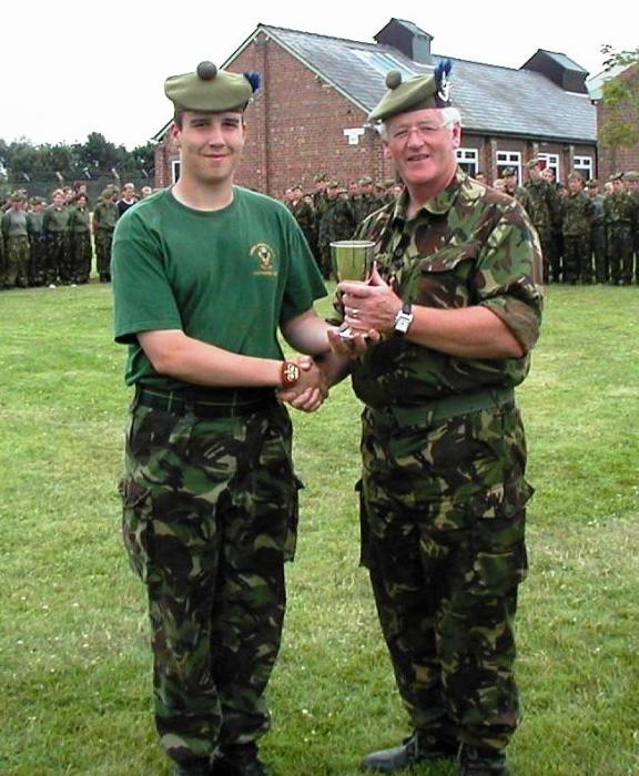 Photo: Prize Giving Time. Cadet CSM Alan Macdonald receives the trophy for the best drill squad commander