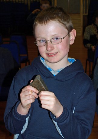 Photo: Age Extremes - Child and 4 Billion Year Old Chondric Meteorite