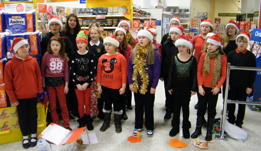 Photo: Caithness and North Sutherland Children's Choir Singing Christmas songs At Tesco