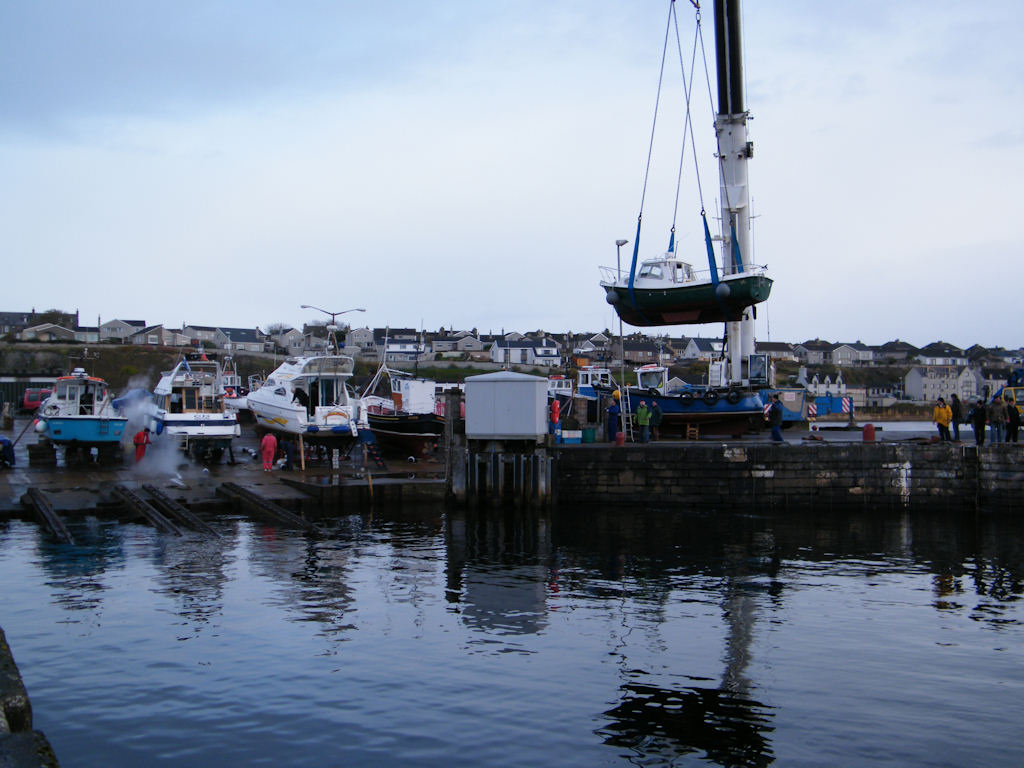 Photo: Lifting Small Boats Out Of The Water At Wick Harbour