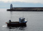 Crab boat near wick Harbour on a calm day in August 2013