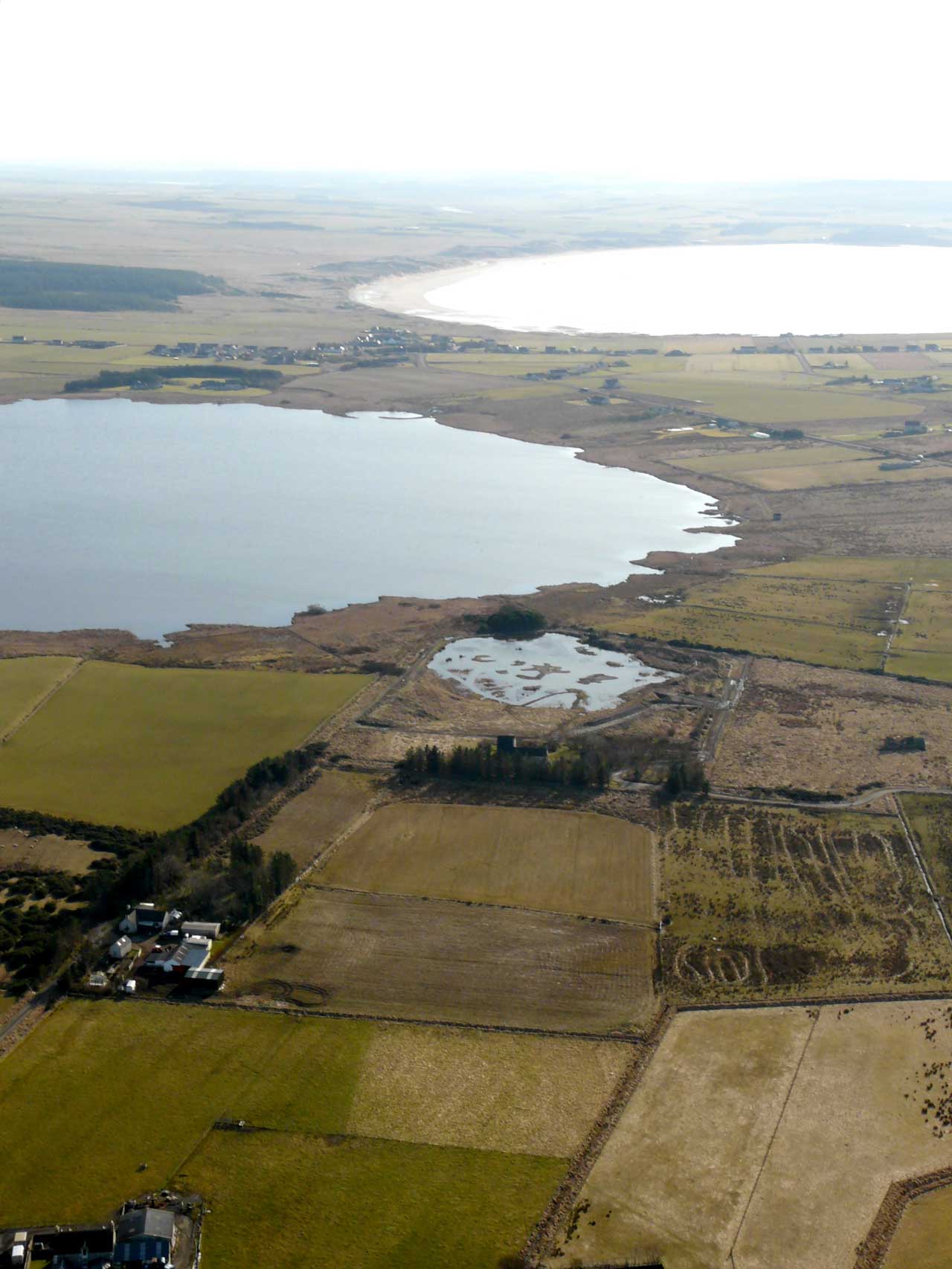 Photo: Aerial shot looking south over St John's Pool to St. John's Loch and beyond to Dunnet Bay