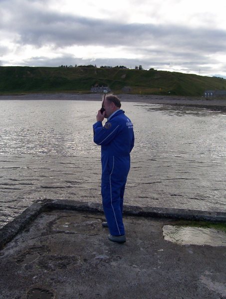 Photo: Coastguard Member With Hand Held Communications