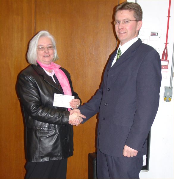 Photo: Mrs Simpson of Wick Harbour Trust Accepting A Cheque From Scottish and Southern Electric