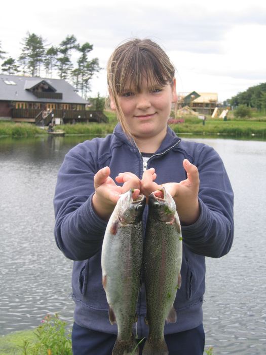 Photo: Danielle McWalter with two rainbow trout