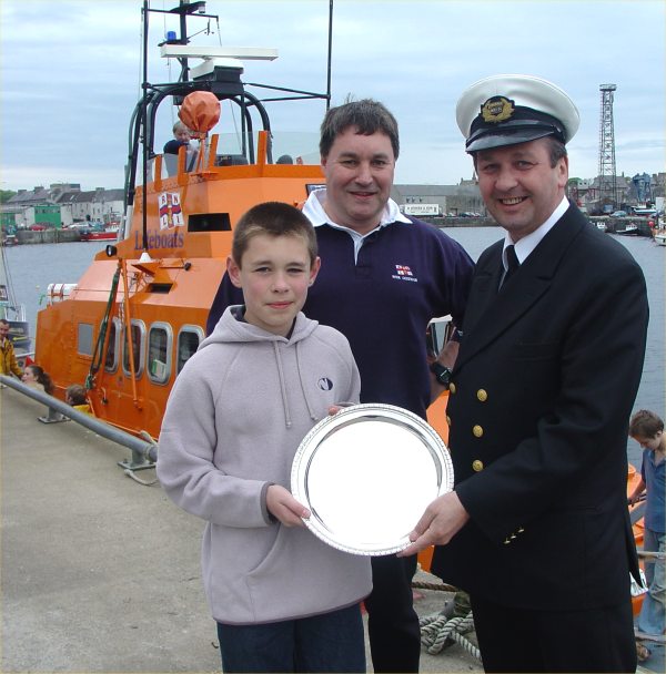Photo: Criag Cormack Receives Award For Services To the Lifeboat From Supt Murray Campbell